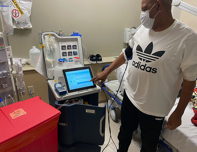 AJ taking his post-treatment blood pressure in-clinic on Tablo, July 2022