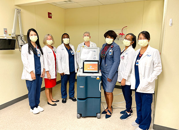 Left to right: Kathleen Kay Bayagos, RN, Karen Garner, RN, Nicolisea Hunt McGregor, BSN, RN, Susan McNeely, RN, Elsie Graves, MHSA, BSN, RN, NEA-BC, Nadja Barrow, RN, and Maggie Villamor, RN, with a Tablo console at AdventHealth Sebring, September 2022