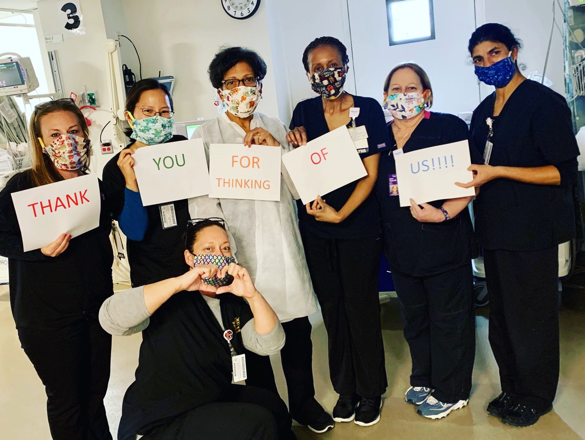 NYU Winthrop nurses hold up Thank You signs