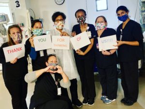 Nurses holding Tablo thank you sign