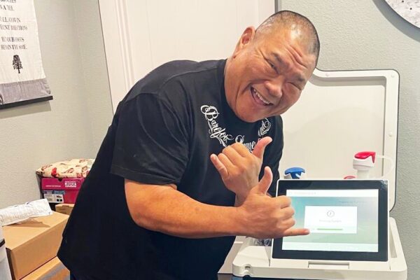 Smiling patient with Tablo dialysis machine
