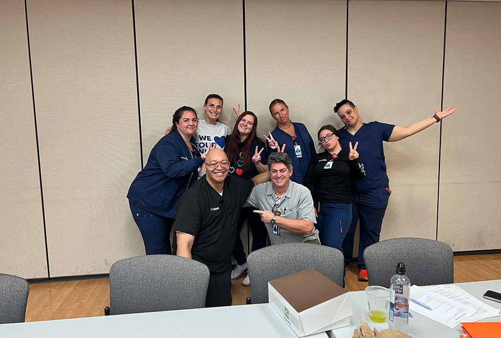 Lionel Bihm Jr., center-left, with a group of Tablo Coordinators, Outset-trained leaders in their Tablo programs