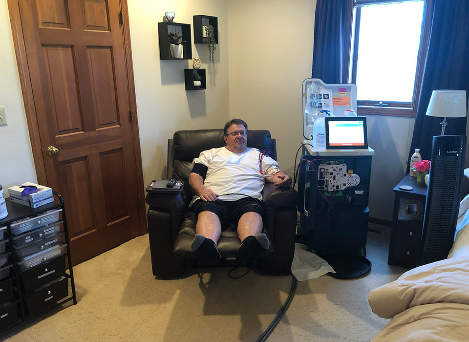 Home hemodialysis patient Tim receiving treatment with the Tablo® Hemodialysis System