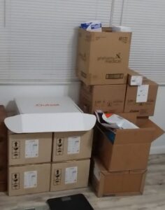 Room with a few boxes of dialysis supplies.
