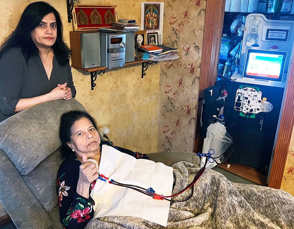 Two women with a Tablo Hemodialysis System, at home